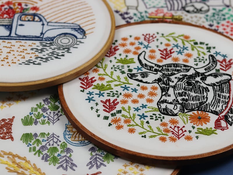 assortment of embroidery hoop art from the Stitched Stories shop. 