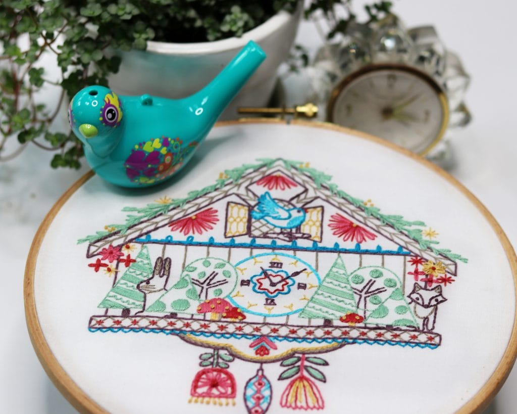 embroidery pattern with vintage woodland cuckoo clock and bluebird. 