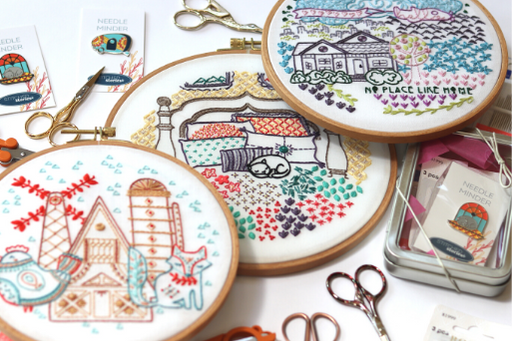 assorted embroidery patterns, scissors and needle minders for your embroidery practice