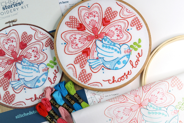 Valentine's Day or love-themed embroidery kit from Stitched Stories. Design with nested repeated hearts and dove and "choose love" message. Kit includes floss, fabric, hoop and more.