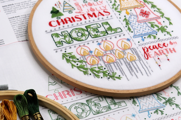 Christmas embroidery project with holiday word art, candles and bells arranged in a grid