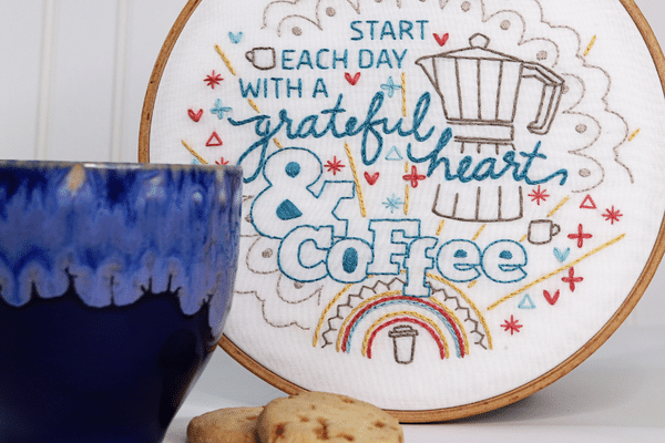 embroidery hoop-art with coffee motifs and saying