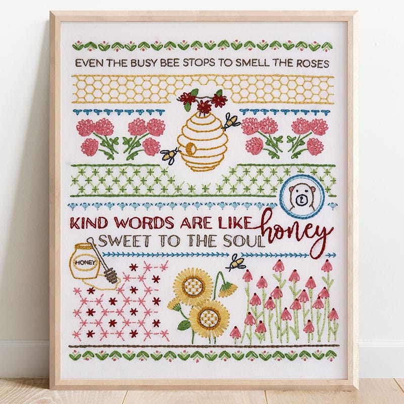 framed embroidery stitch sampler with honeybee theme