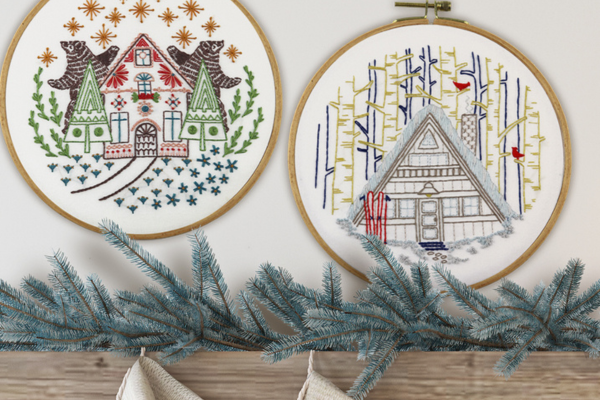 winter-themed embroidery hoop-art displayed over the mantle