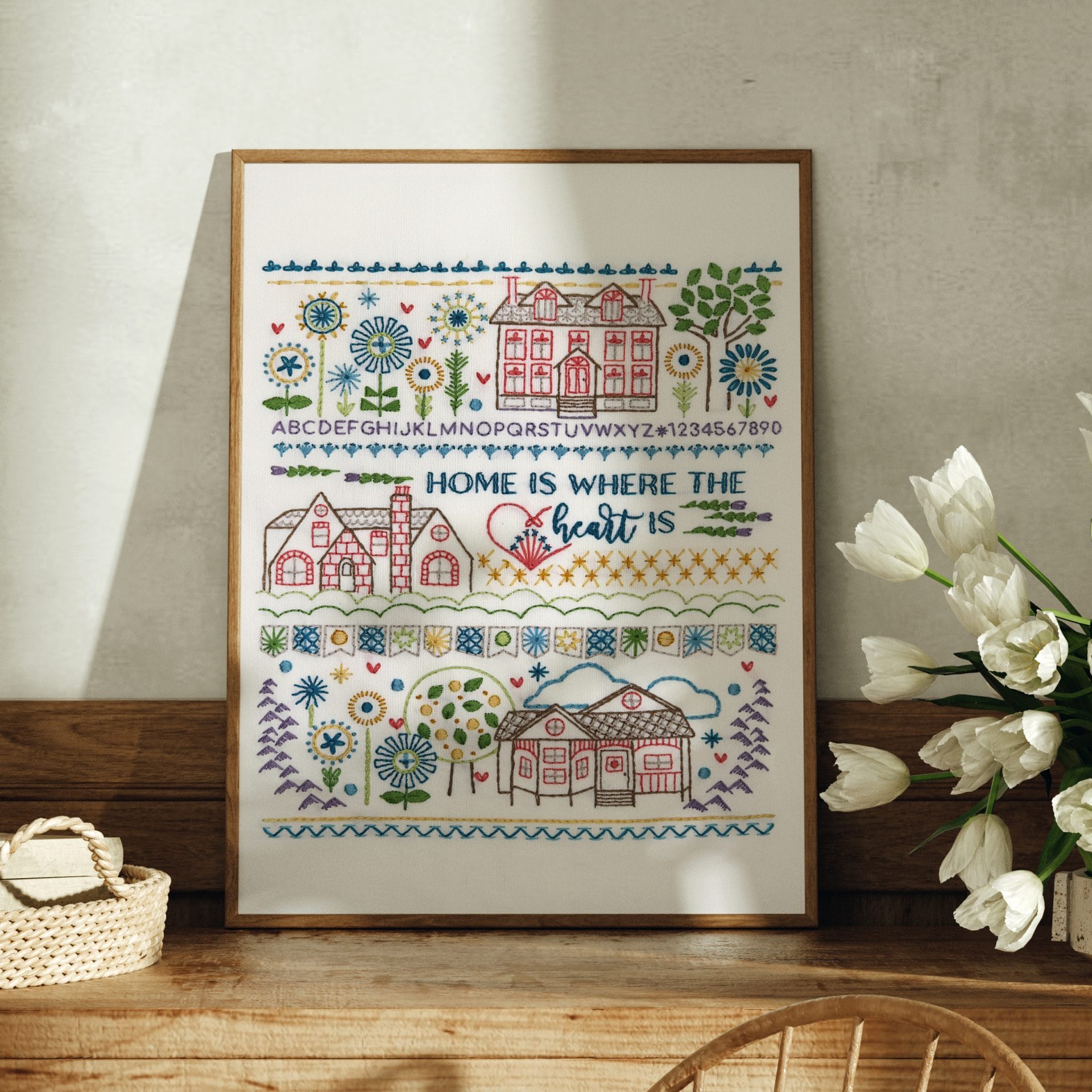 Traditional embroidery stitch sampler with home theme
