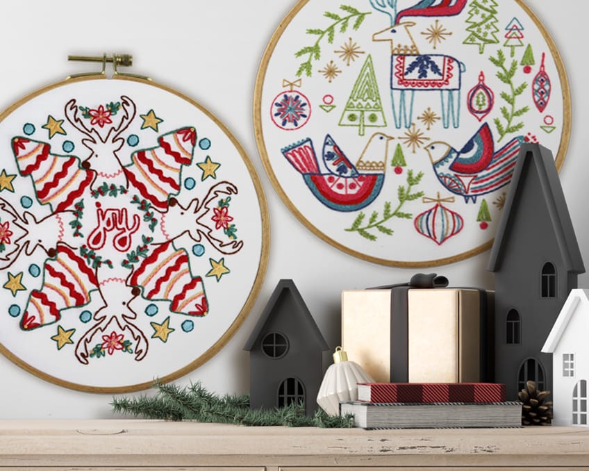 Bright and simple Christmas embroidery displayed in a styled holiday vignette.