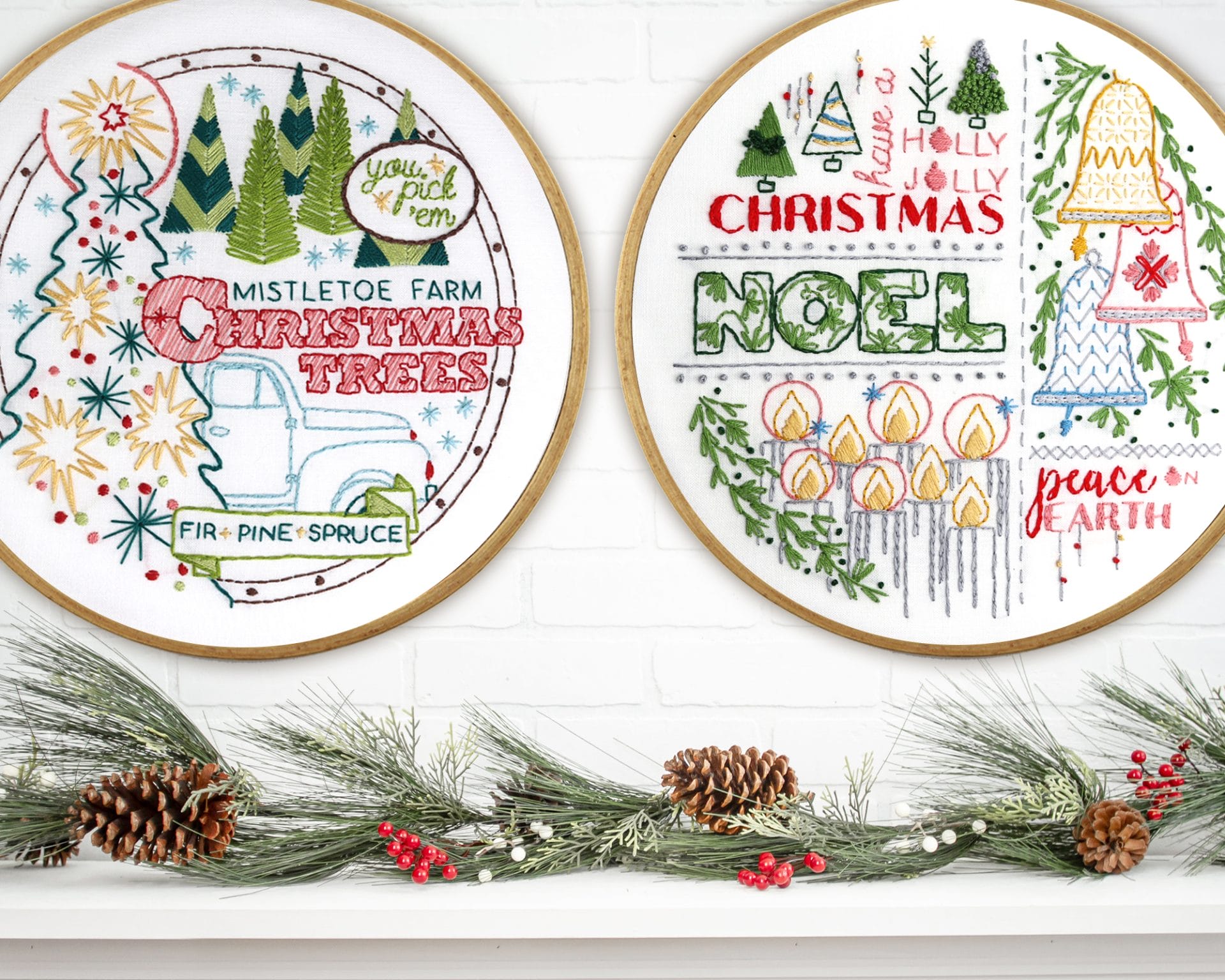 Embroidered hoop art Mistletoe Farm and Noel displayed above a pine-covered mantle.